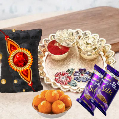 send fererro rocher, kaju katli, mixed flowers and dryfruits with rakhi to belgaum